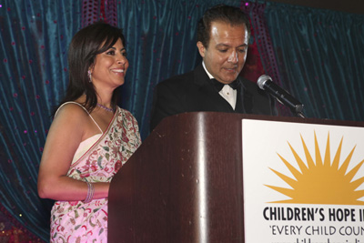 Poonam beside AJ Khubani as he speaks at the 2009 Children’s Hope India gala